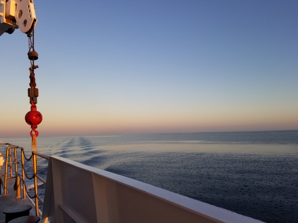 Looking out at the sea from a research vessel's deck.
